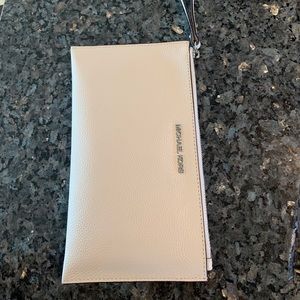 White Michael Kors wristlet